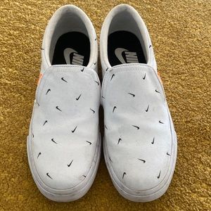 Slip on Nike sneakers.